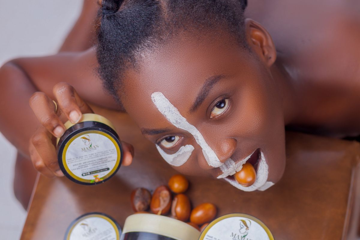 Lotion pump, cream tub, and butter jar arranged on a bathroom shelf