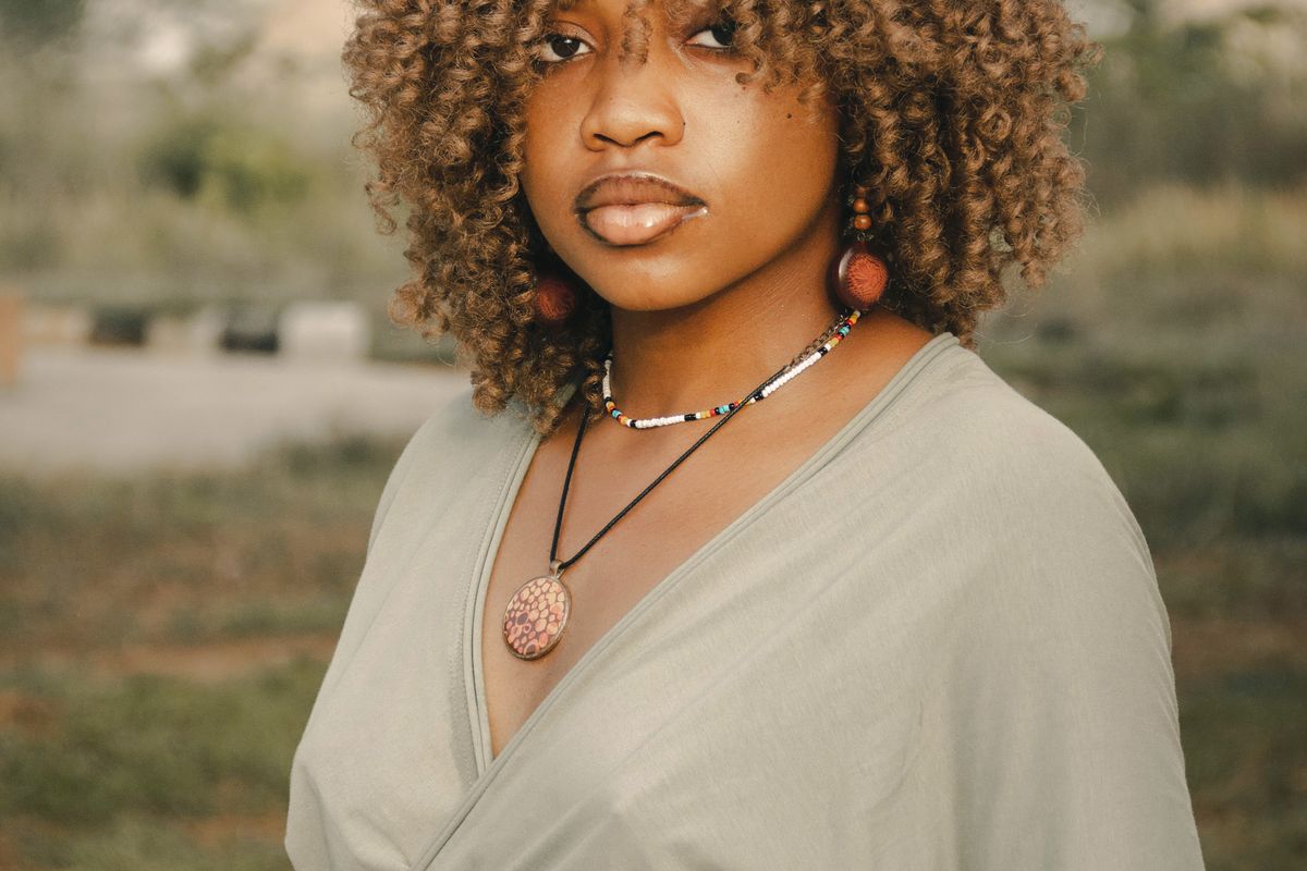 Woman with natural curly hair outdoors