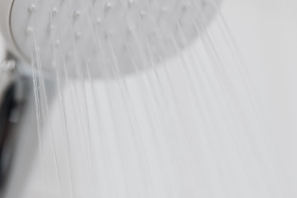 Shampoo bottles lined up in a shower