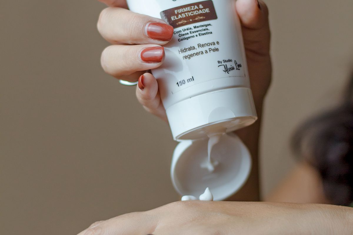 Open jar of face cream with texture